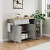 A kitchen cart with a wooden top, gray cabinets, and a towel rack is shown in a room with wooden floors and a window. Náhled obrázku produktu
