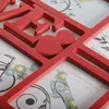 A close-up view of a red multi-photo frame with the letters 'L', 'O', 'V', 'E' and two hearts. Náhľad obrázku produktu