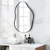 A bathroom vanity with a sink, faucet, and a decorative mirror. Produktbild-Vorschau