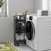 A narrow rolling cart filled with bottles and containers is placed next to a washing machine in a laundry room. Produktbild-Vorschau