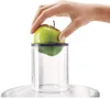 A hand holding a green apple over a clear plastic container. Anteprima dell’immagine prodotto