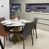 A dining table with chairs in a modern kitchen or dining room setting. Produktbild-Vorschau