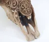 A close-up view of a decorative skull with intricate tribal patterns. Podgląd zdjęcia produktu