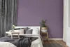 A bedroom scene with a bed, curtains, and a plant. Podgląd zdjęcia produktu