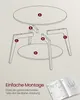 An exploded view diagram of a table assembly, with labels and an open instruction manual. Produktbild-Vorschau