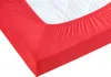 A close-up view of a red fitted sheet on a mattress. Produktbild-Vorschau