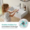 A young girl washes her hands in a modern white ceramic sink with a chrome faucet. Anteprima dell’immagine prodotto