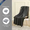A dark gray blanket draped over a chair, with product information displayed on the left side. Náhľad obrázku produktu