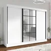 A white wardrobe with mirrored doors and a black frame is shown in a room. Produktbild-Vorschau