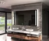 A modern bathroom vanity with a large LED mirror, two sinks, and wooden cabinetry. Produktbild-Vorschau