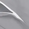 A close-up view of a gray fabric with a white zipper. Produktbild-Vorschau