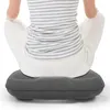 A person is sitting on an inflatable cushion. Náhled obrázku produktu