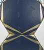 A close-up view of a dark blue soccer ball with gold accents and embossed star-like patterns. Náhľad obrázku produktu