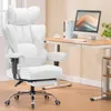 A white ergonomic office chair is placed next to a wooden desk with a computer and books. Náhľad obrázku produktu
