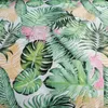 A close-up view of a fabric with a tropical leaf pattern. Náhľad obrázku produktu