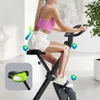 A woman is using an exercise bike indoors, with anatomical diagrams highlighting the benefits for bones and joints. Anteprima dell’immagine prodotto
