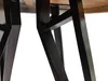 Close-up view of the black metal legs of a table. Náhled obrázku produktu