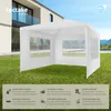 A white pavilion is set up on a green lawn in front of a modern house, with a swimming pool in the background. Náhled obrázku produktu