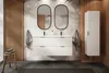 A modern bathroom with a double vanity, tropical wallpaper, and wooden accents. Voir les images du produit