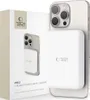 A product shot of a white power bank attached to the back of a smartphone, with its packaging in the foreground. Náhľad obrázku produktu