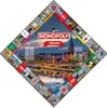A diamond-shaped Monopoly board featuring a city skyline and various game spaces. Produktbild-Vorschau