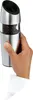 A hand holding a pepper grinder. Anteprima dell’immagine prodotto