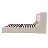A side view of a beige upholstered bed frame with a slatted mattress support and LED lighting in the headboard. Náhled obrázku produktu