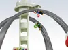 Two toy race cars on a track with a tower. Produktbild-Vorschau