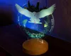 A Harry Potter-themed owl night light with a Hogwarts castle silhouette in the background, displayed on a wooden base. Produktbild-Vorschau