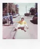Two people on a street, one on a skateboard. Produktbild-Vorschau