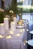A table set for a party with LED candles and string lights. Náhled obrázku produktu