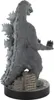 A gray Godzilla figurine standing on a base of miniature buildings. Produktbild-Vorschau