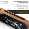 Close-up of a digital radio alarm clock with a wood-grain finish, displaying the time and radio frequency. Produktbild-Vorschau