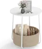 A white round side table with a storage basket underneath, containing books and pens. A vase with pink flowers and a framed picture are on top of the table. Anteprima dell’immagine prodotto