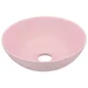 A pink ceramic sink with a drain hole in the center. Náhled obrázku produktu