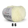 A ball of light yellow yarn with a label. Náhled obrázku produktu