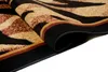 A close-up view of a rolled-up rug with a tiger stripe pattern. Produktbild-Vorschau