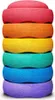 A stack of colorful, circular balancing stones. Voir les images du produit