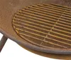 Close-up view of a rusty metal grill grate inside a fire pit. Produktbild-Vorschau