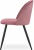 A side view of a single pink velvet chair with black legs, isolated on a white background. Náhled obrázku produktu