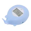 A light blue whale-shaped bath thermometer. Produktbild-Vorschau