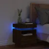 A bedside table with LED lights next to a bed. Podgląd zdjęcia produktu