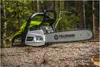 A chainsaw rests on a fallen tree in a forest. Náhľad obrázku produktu