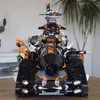A front view of a LEGO vehicle on a table, with a plant in the background. Produktbild-Vorschau