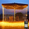 A patio umbrella decorated with yellow net lights at dusk, with chairs and tables visible underneath. Produktbild-Vorschau