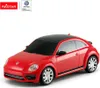 A red Volkswagen Beetle toy car with a black roof is shown against a white background. Náhled obrázku produktu