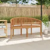 A wooden bench sits on a patio in front of a bamboo fence. Produktbild-Vorschau