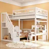 A white bunk bed with a desk and storage integrated into the structure, set in a room with orange walls and a circular rug on the floor. Produktbild-Vorschau