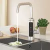 A modern kitchen sink area with a smart faucet dispensing water into the sink, next to some apples and garlic on a cutting board, and a potted plant. Produktbild-Vorschau