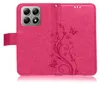 A pink flip phone case with a floral and butterfly embossed pattern. Produktbild-Vorschau